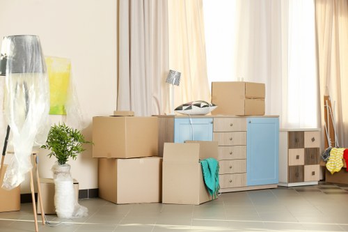 Professional flat removal team packing boxes in Dagenham apartment