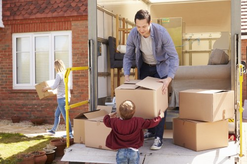 Removal staff protecting furniture during a flat move