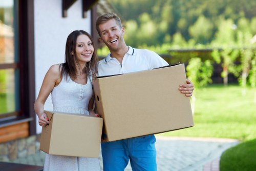 Professional movers handling furniture during a Dagenham house move