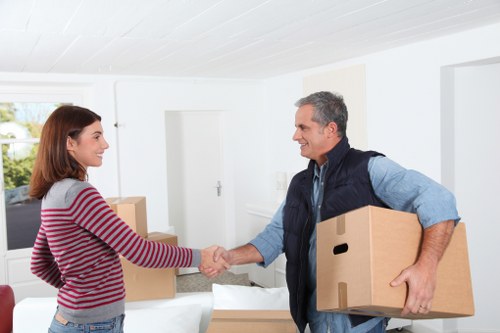 Home relocation packing team organizing fragile items in Dagenham
